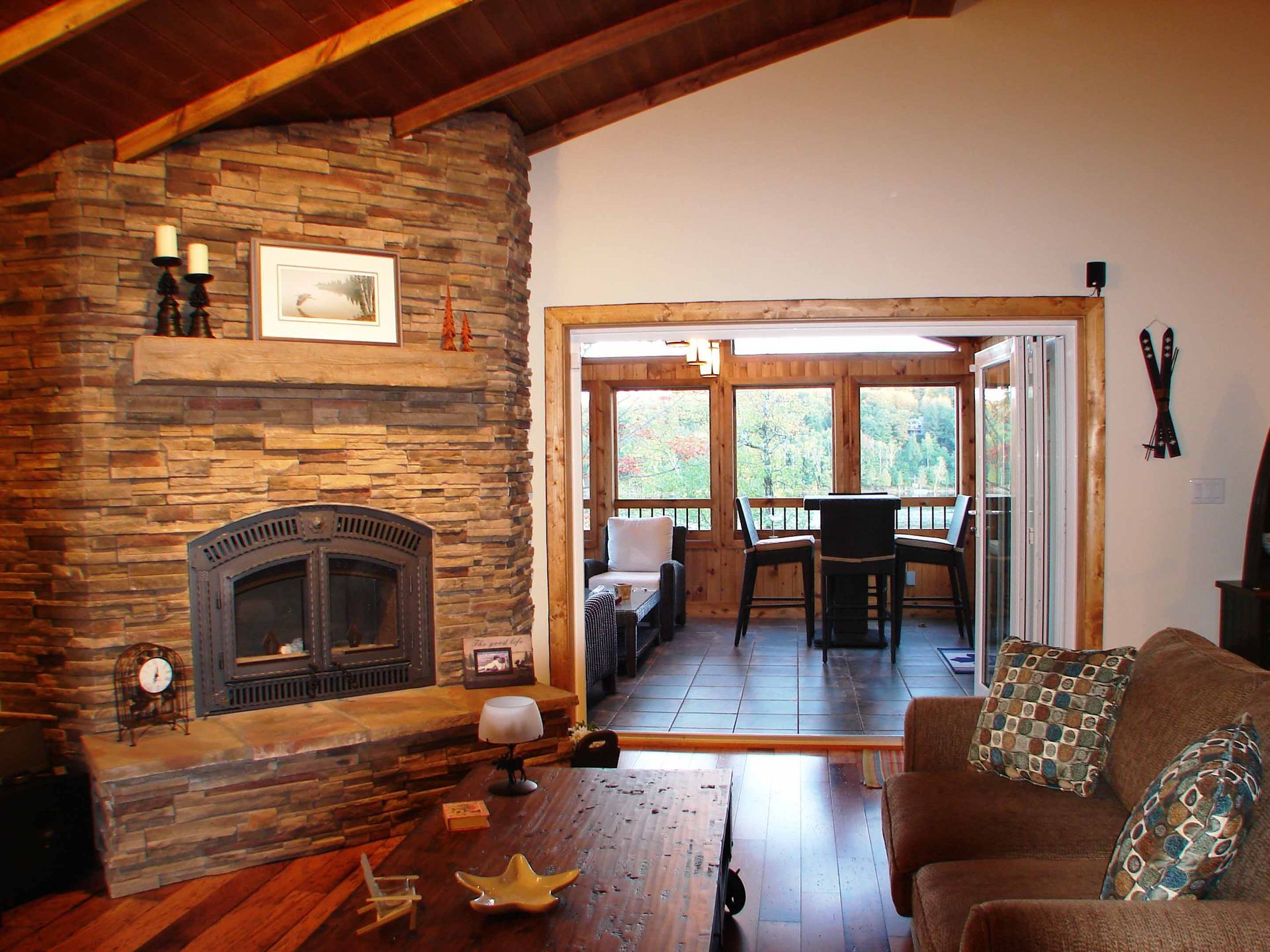 A living room with a fireplace and a couch