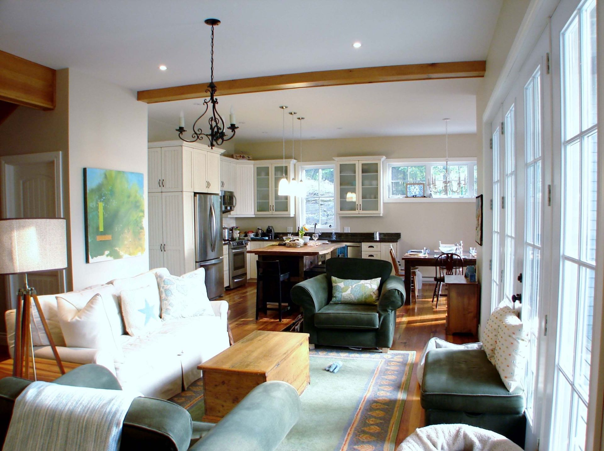 A living room with a couch a chair and a coffee table