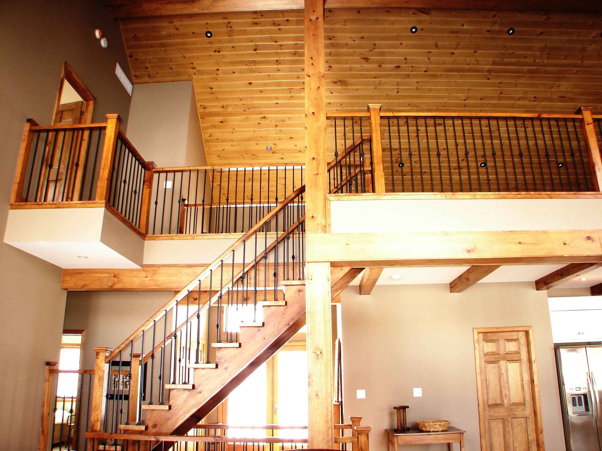 A wooden staircase leading up to the second floor of a house