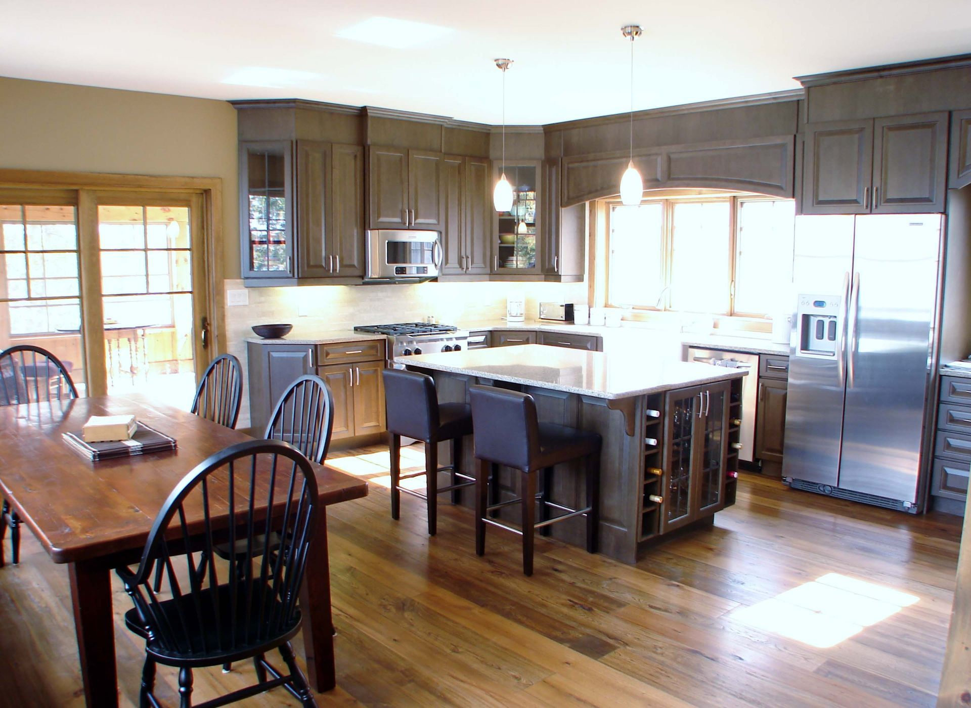 A kitchen with stainless steel appliances and a large island