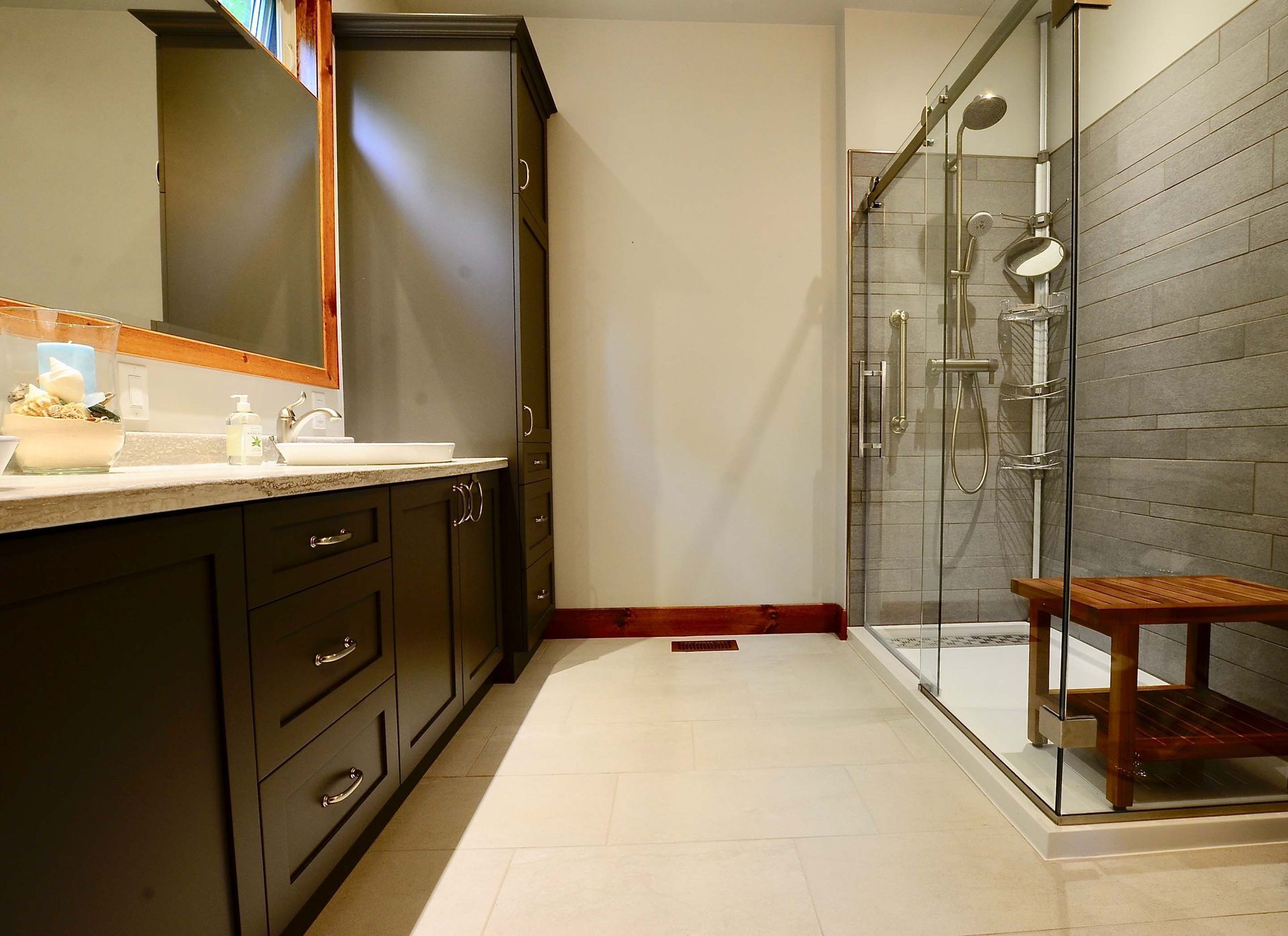 A bathroom with two sinks and a walk in shower