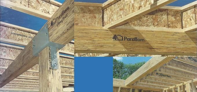 A picture of a house being built with wooden beams.