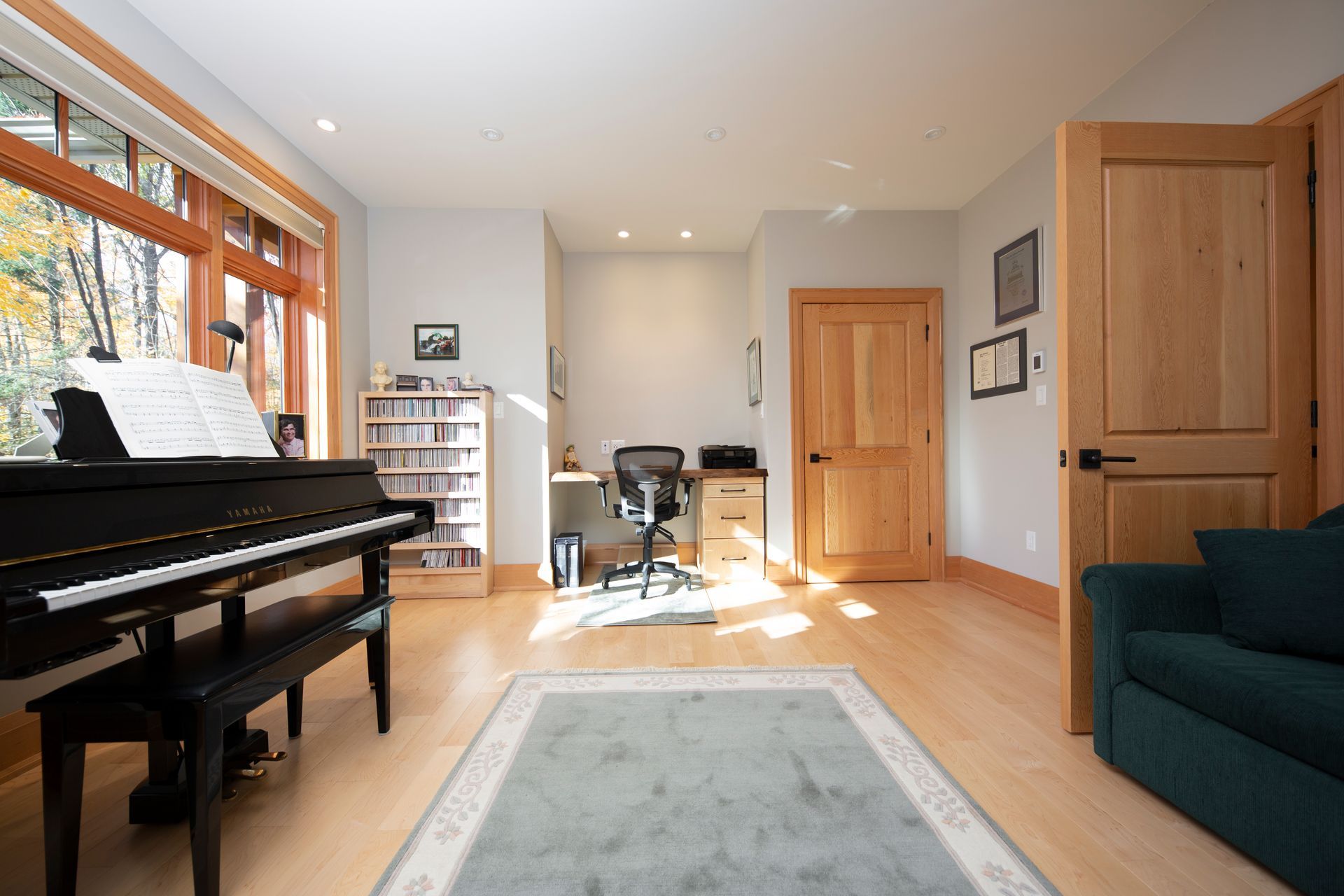 A living room with a piano and a couch