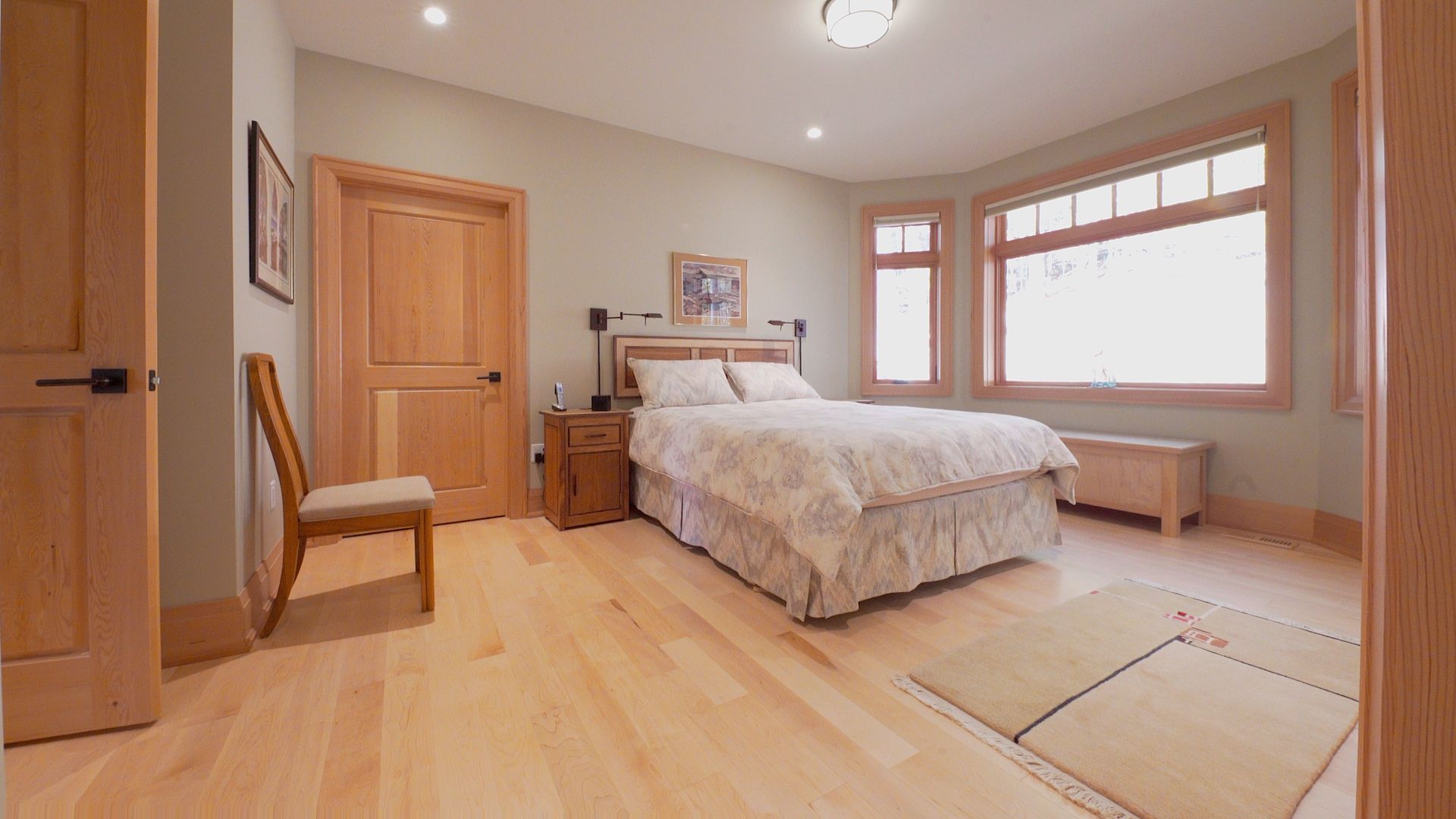 There is a large bed in the middle of the room.