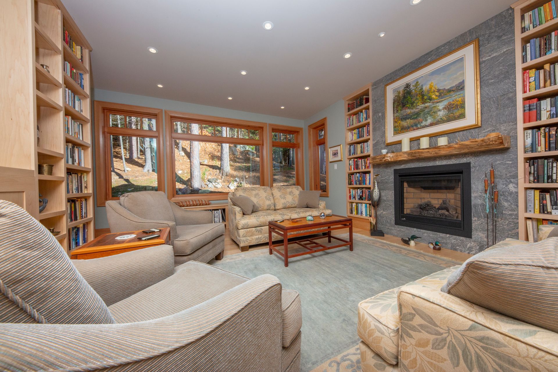 A living room filled with furniture and a fireplace.
