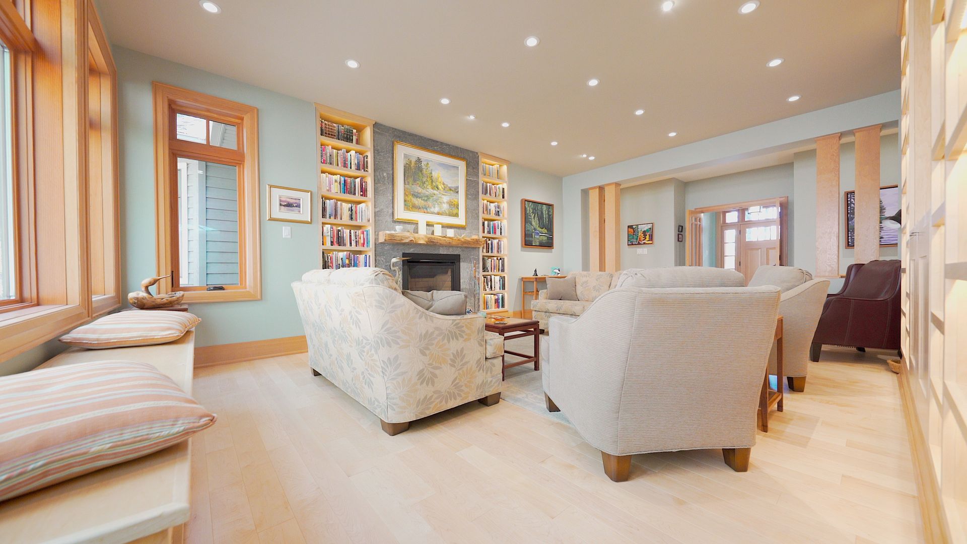 A living room filled with furniture and a fireplace.