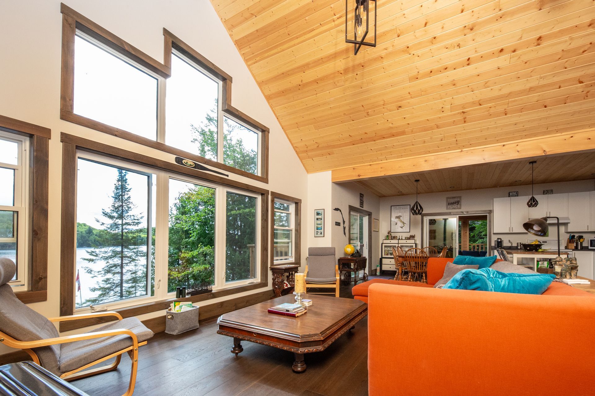 A living room with a lot of windows and a couch