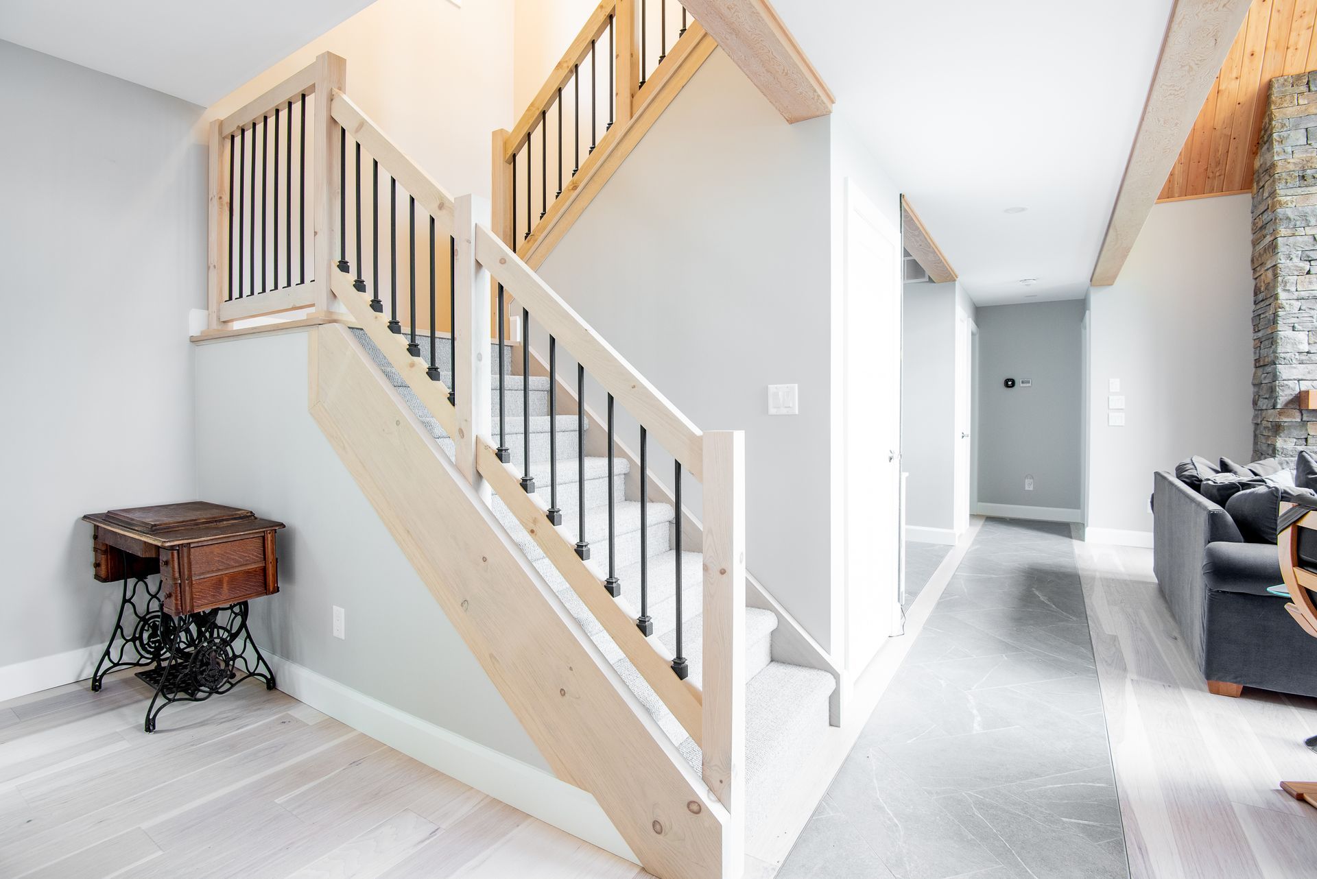 A wooden staircase leading up to the second floor of a house.