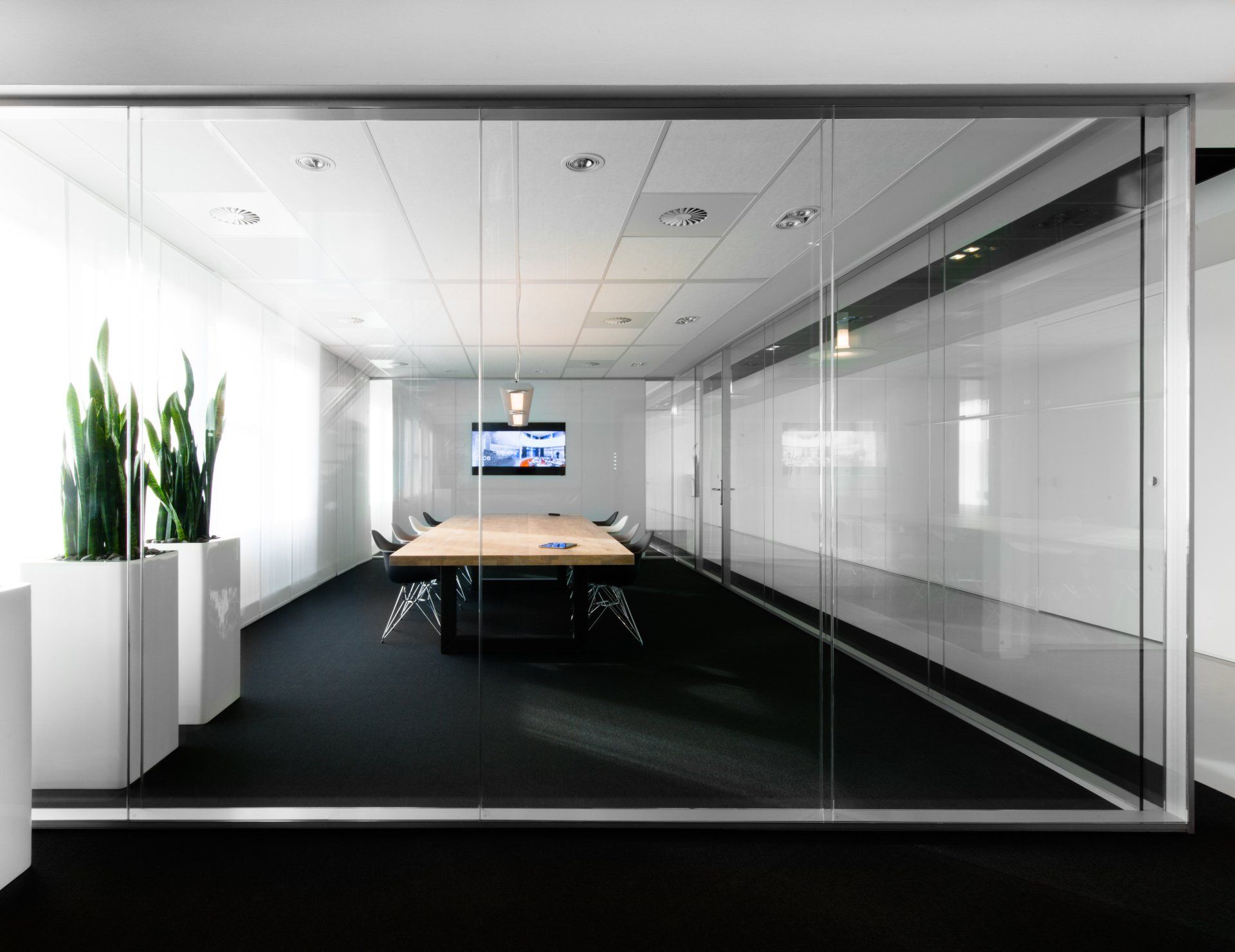 office space with frameless glass room
