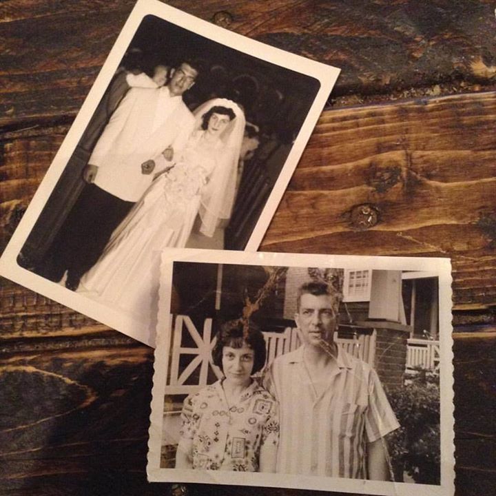 Two black and white photos of a bride and groom on a wooden table