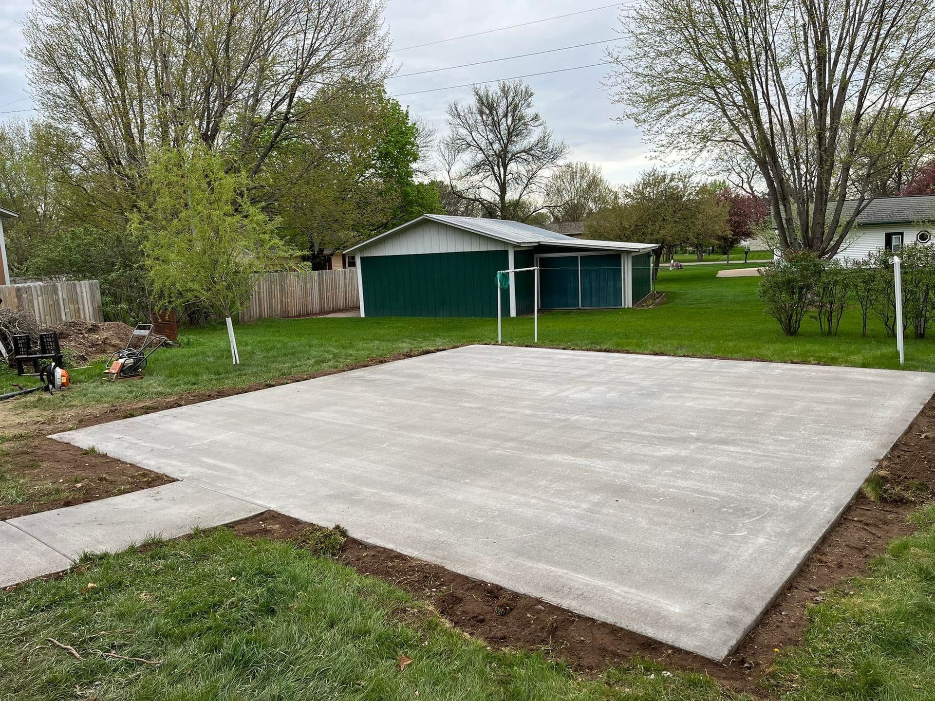 A concrete  court is being built in the backyard of a house by Leland Construction and Concrete Company. Eau Claire WI.