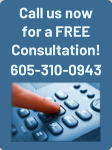 A person is pressing a button on a phone that says call us now for a free consultation