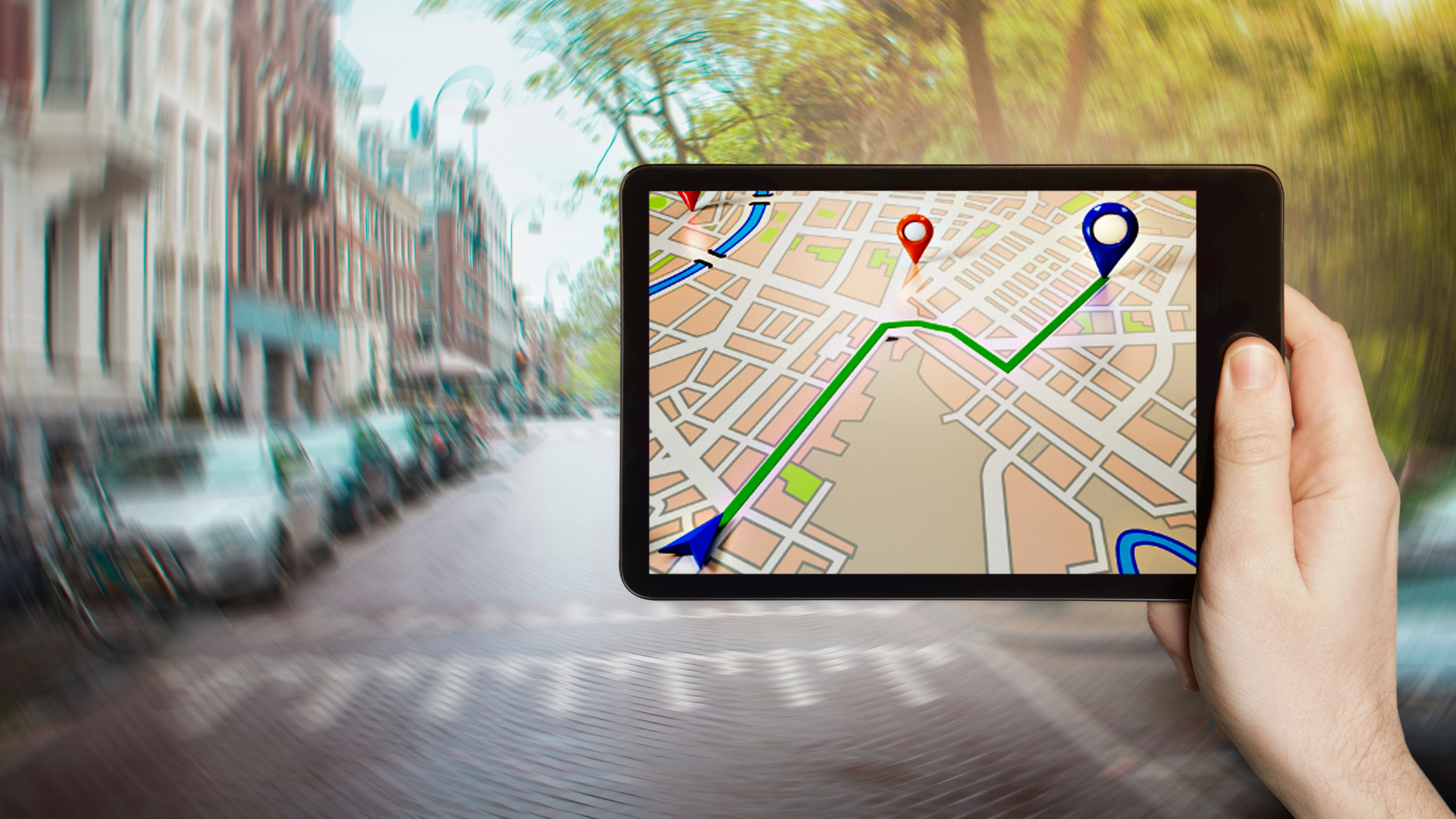 A person is holding a cell phone with a map on it.