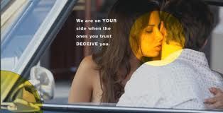 A man and a woman are kissing in a car.