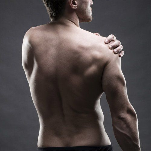 Muscular Therapy — Man Having Shoulder Muscle Pain in Woburn, MA