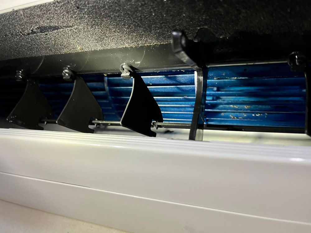 A Close Up Of The Inside Of An Air Conditioner With A Blue Fan — More Clean Air In Cessnock, NSW