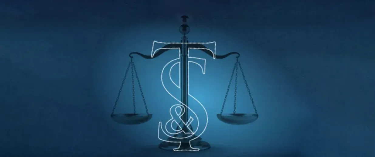 A scale of justice with a dollar sign drawn on it.