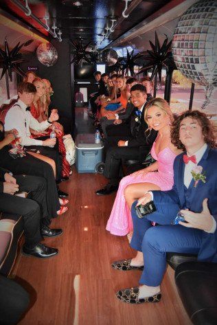 Students in Bus Wearing Their Prom Attire