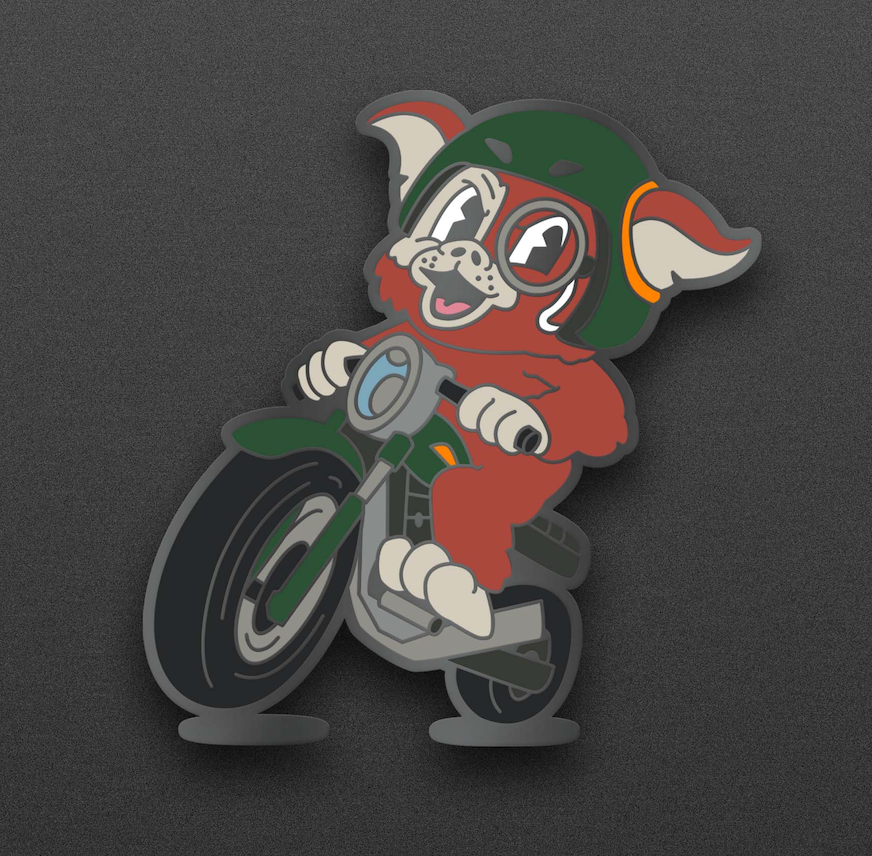 A Gremlin wearing a helmet and goggles is riding a motorcycle