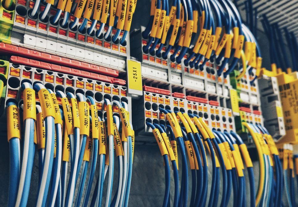 Electrical Cables Plugged Into Power Supply — Barnes Electrical in Gladstone, QLD