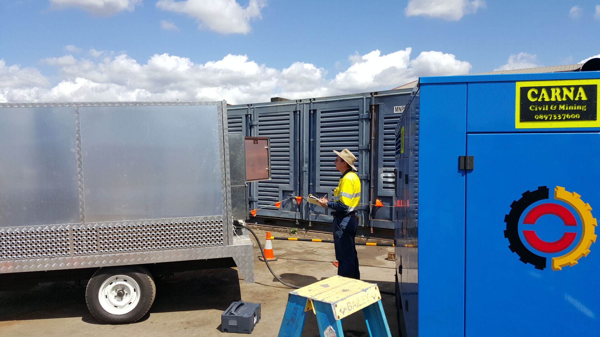 A Man Work Stand Up And His Checking — Barnes Electrical in Gladstone, QLD