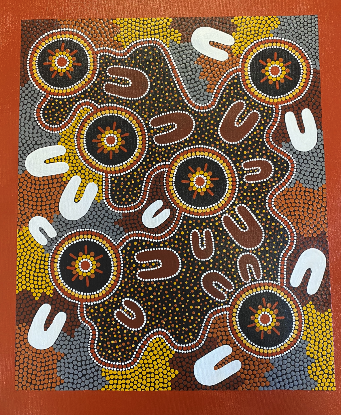 A painting of circles and u 's on a red background