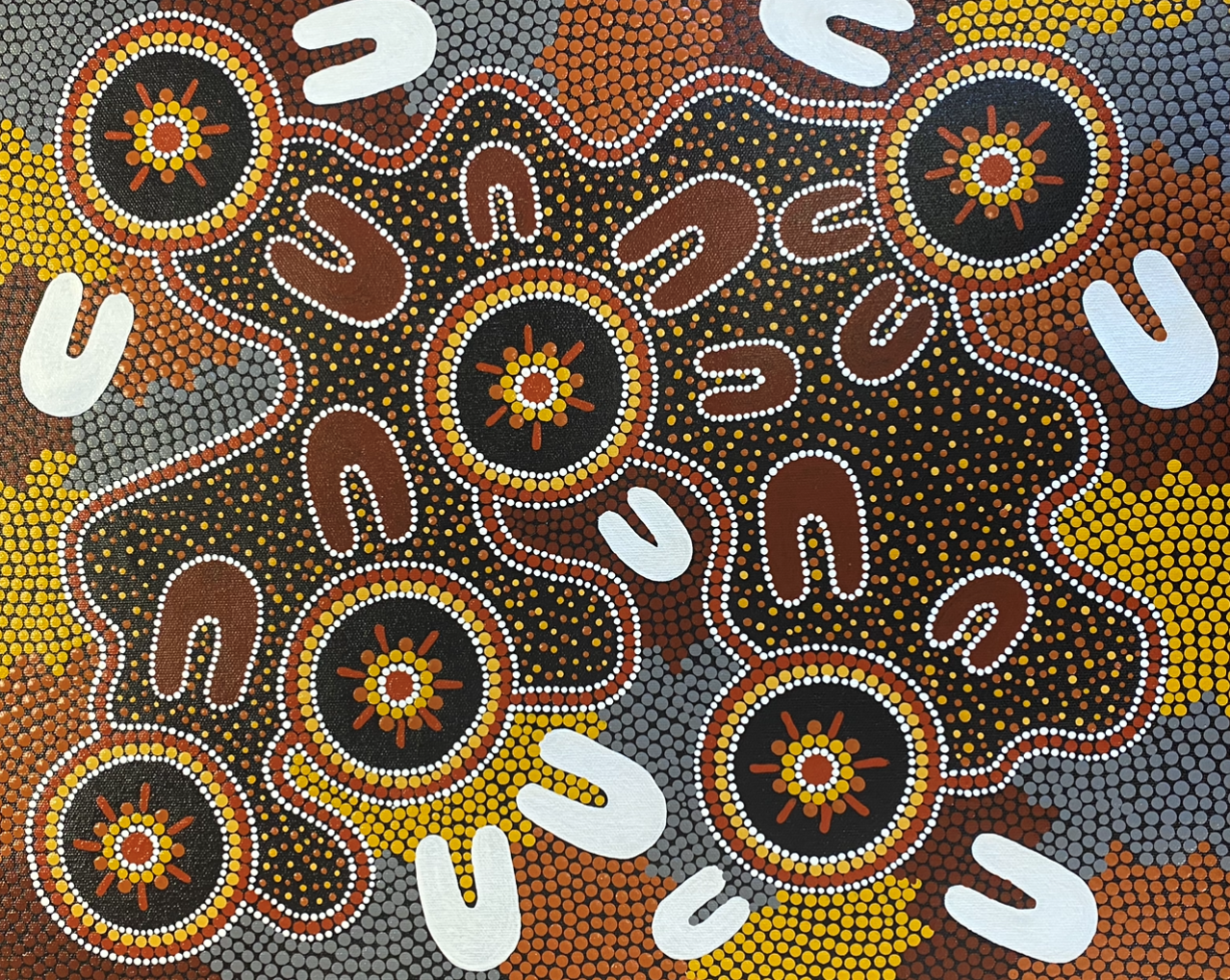 A painting with circles and letters that says u on it