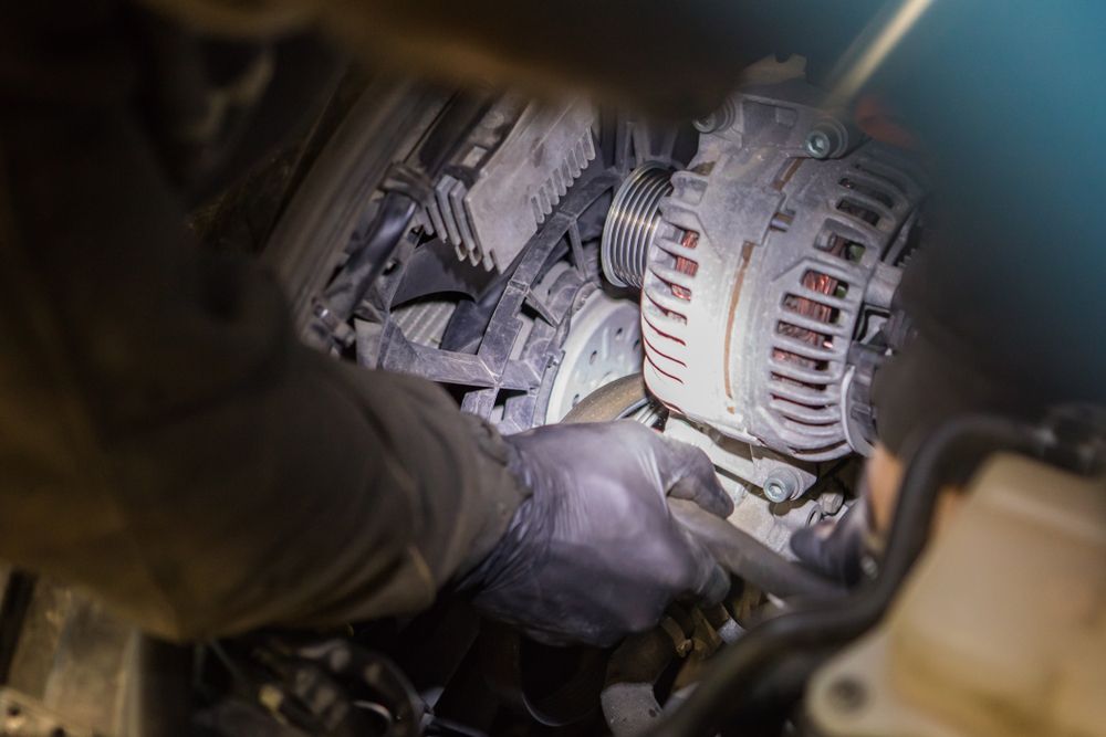 A Mechanic Works on the Alternator and Radiator  of an Engine Bay — Deri's Mobile Mechanical In Parap, NT