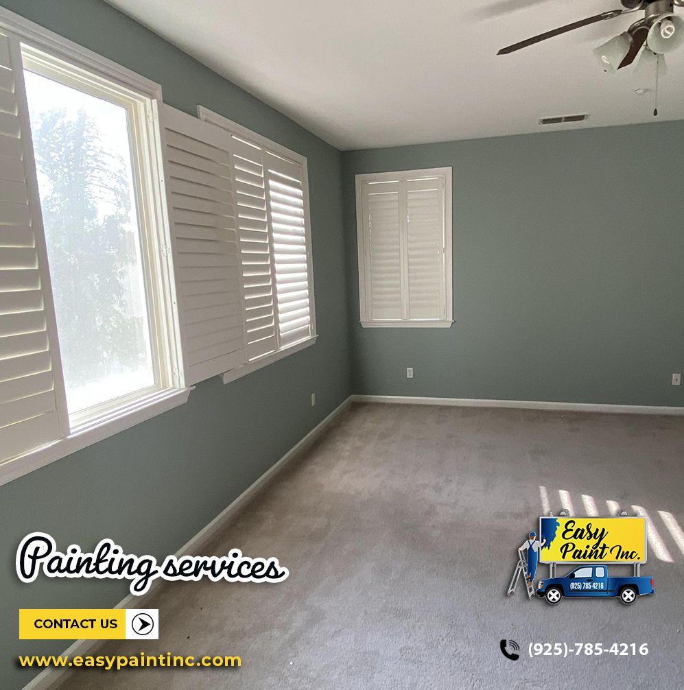 Bedroom with gray walls, white shutters, and carpet. Painting services logo in corner.
