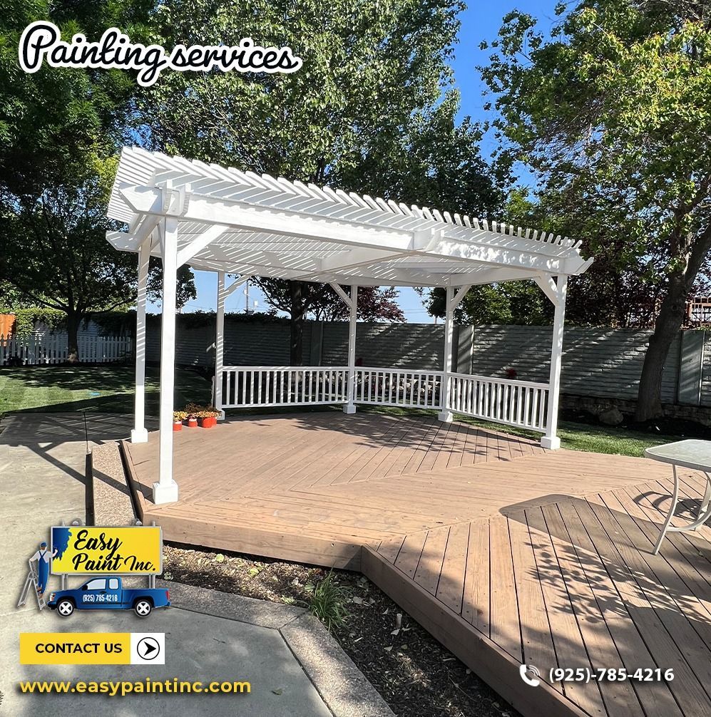 White pergola on a wooden deck. Easy Paint Inc. logo displayed.