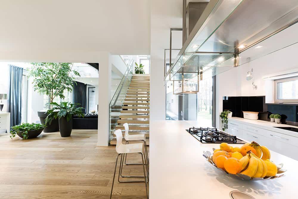 Staircase, living room and island kitchen