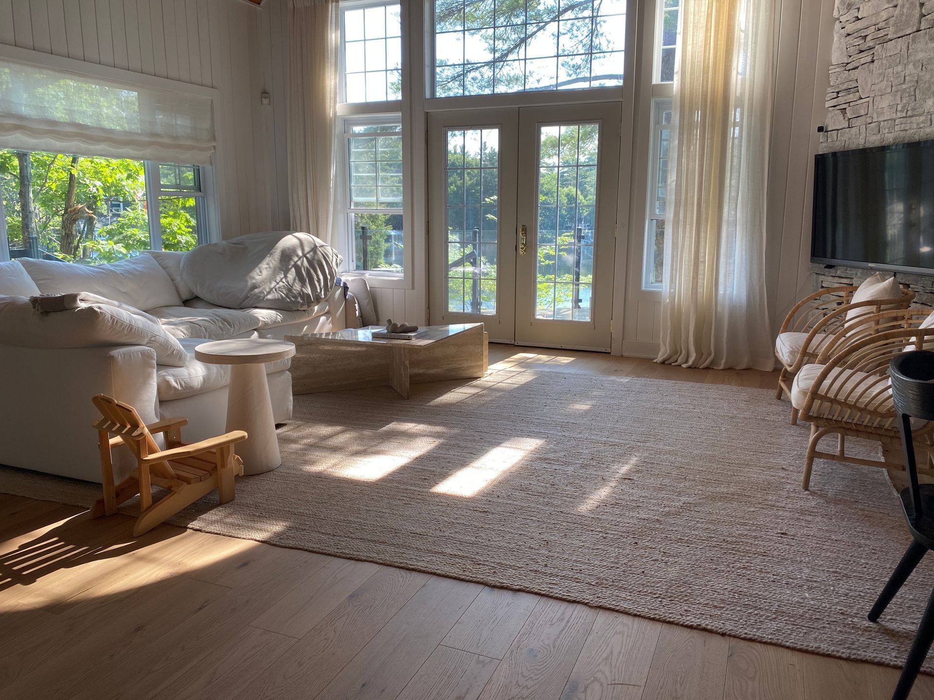 A living room with a couch , chairs , and a fireplace.