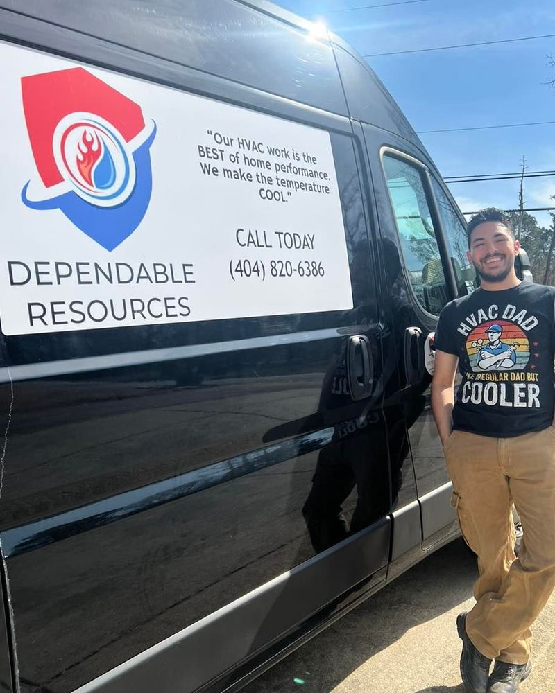 A man is standing in front of a van that says dependable resources