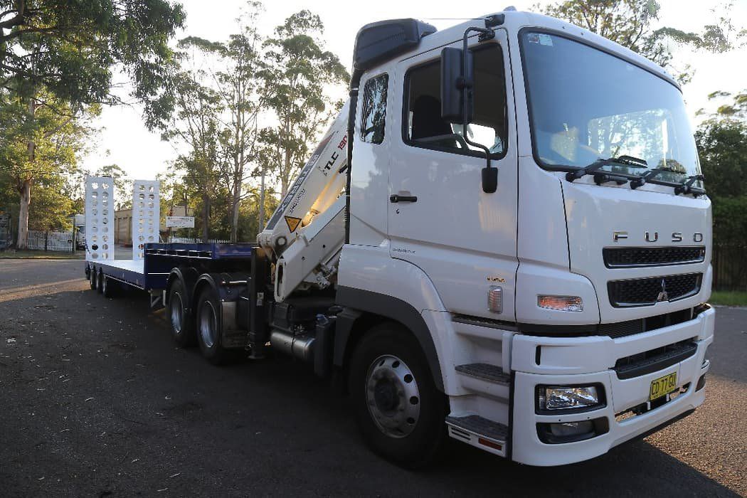 front of a truck with a drop deck widener