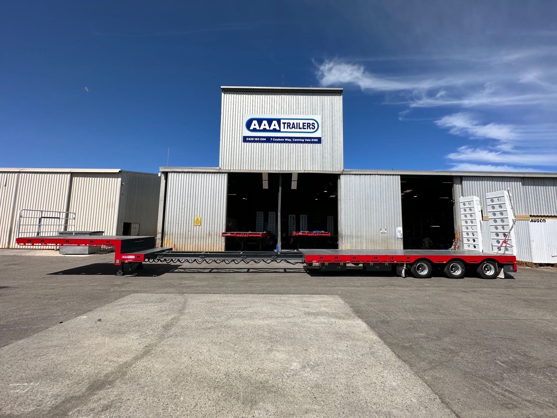 extendable drop deck in front of AAA Trailers warehouse