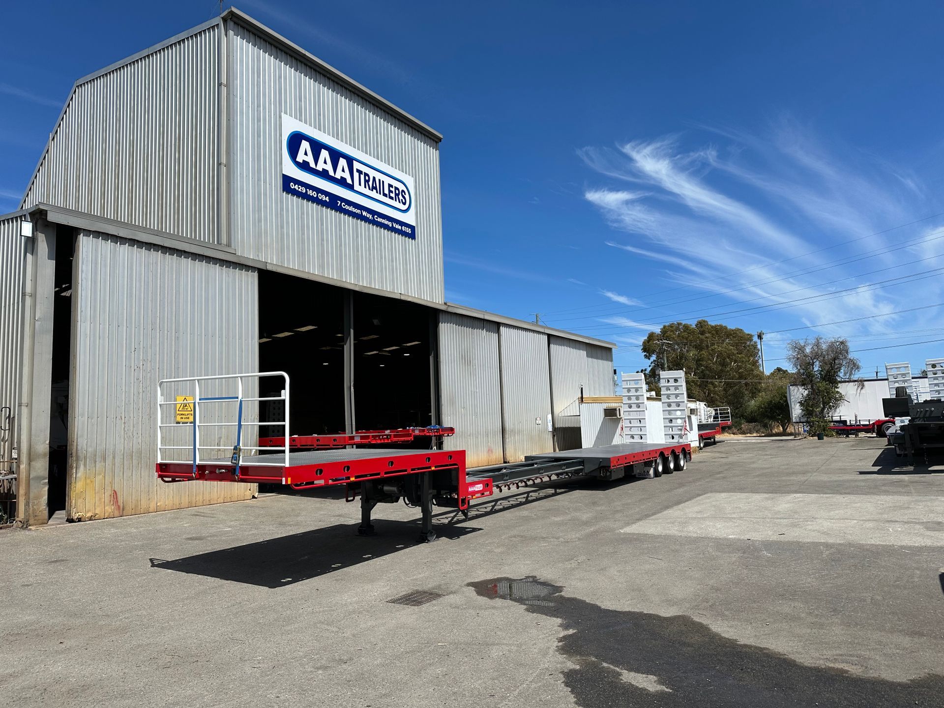 extendable drop deck with bi fold ramps