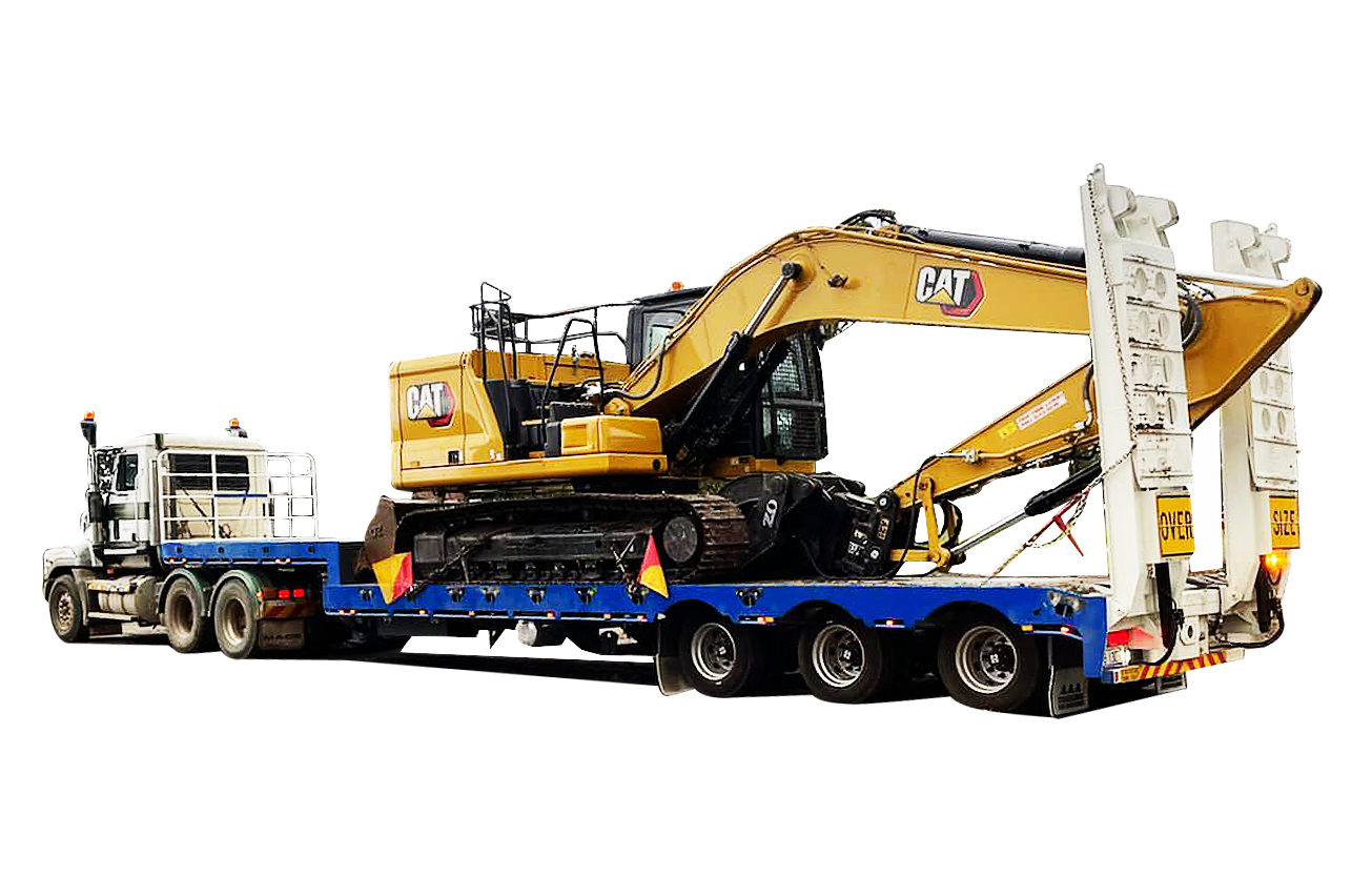 A large excavator is being transported on a flatbed trailer