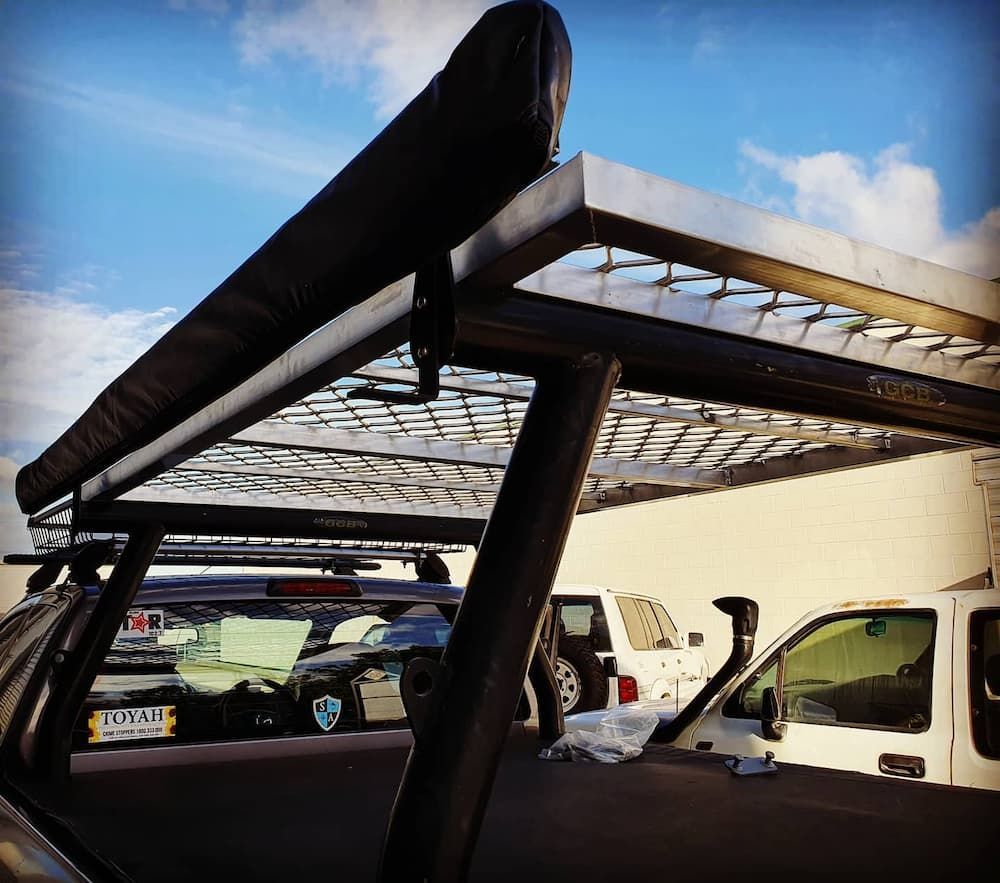 A White Truck Parked Next To A White Van — MTM Automotive in Bentley Park, QLD