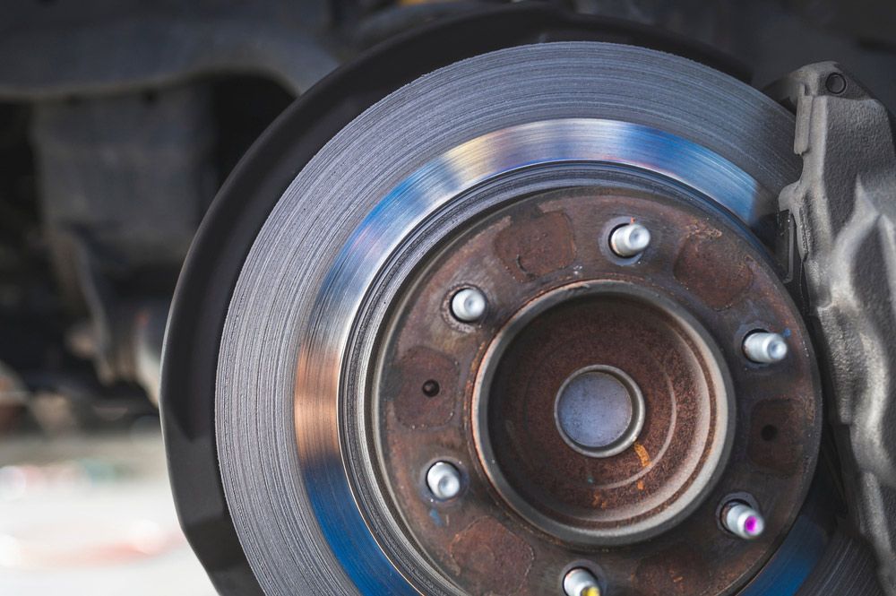 A Close Up Of A Brake Disc On A Car — MTM Automotive in Bentley Park, QLD