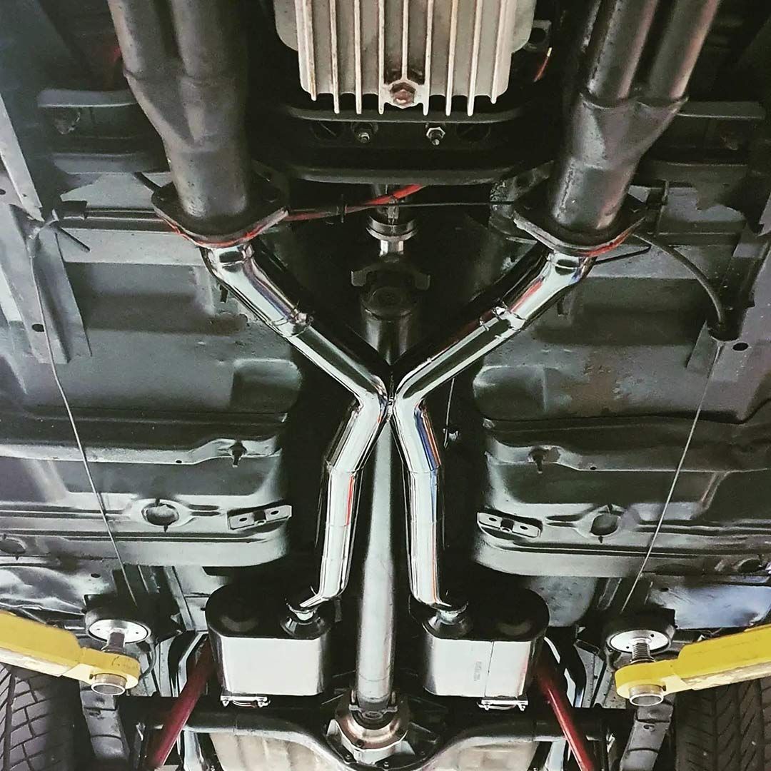 A Close Up Of The Underside Of A Car With Exhaust Pipes — MTM Automotive in Bentley Park, QLD