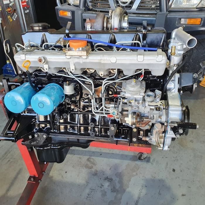 The Engine Of A Car Is Being Worked On — MTM Automotive in Bentley Park, QLD