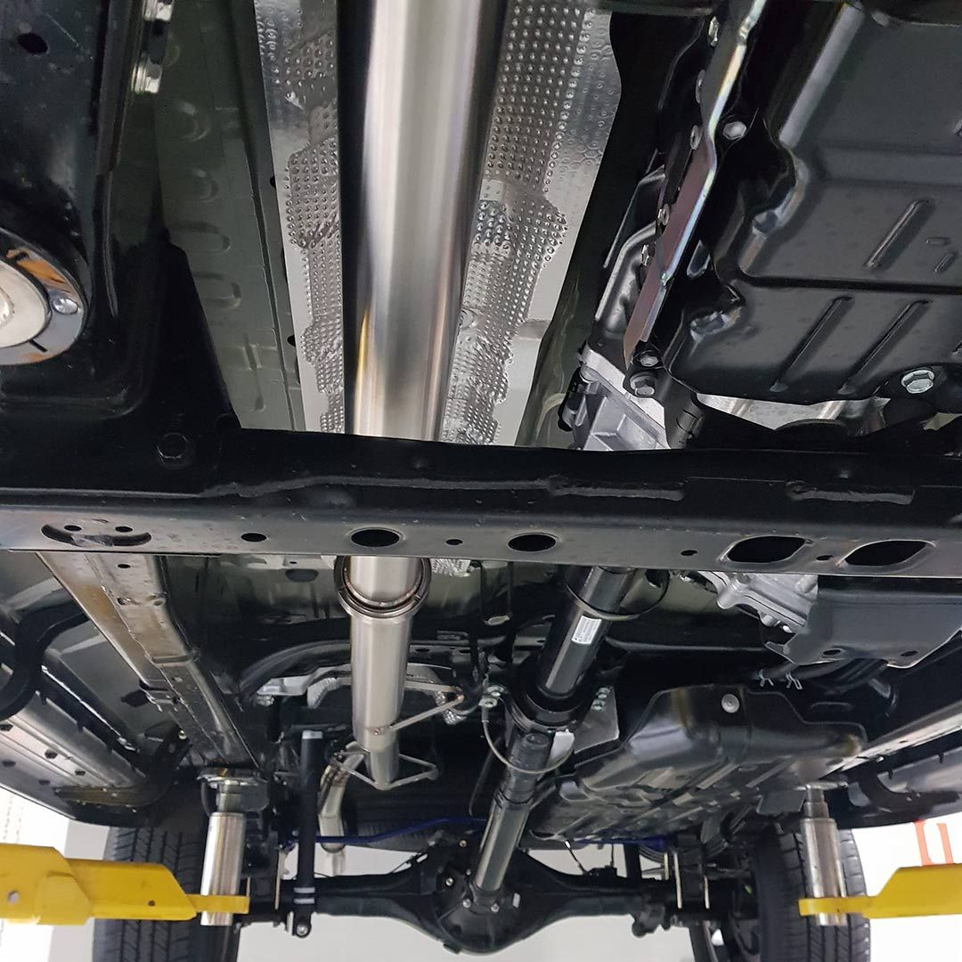 The Underside Of A Car Is Shown In A Garage — MTM Automotive in Bentley Park, QLD