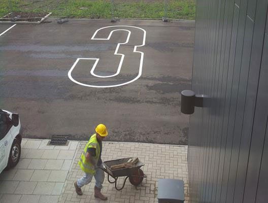 A 9-foot number 3 on tarmac