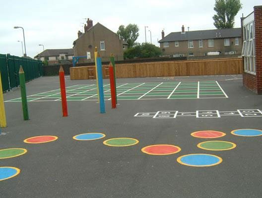 A playground with hopscotch and grid markings