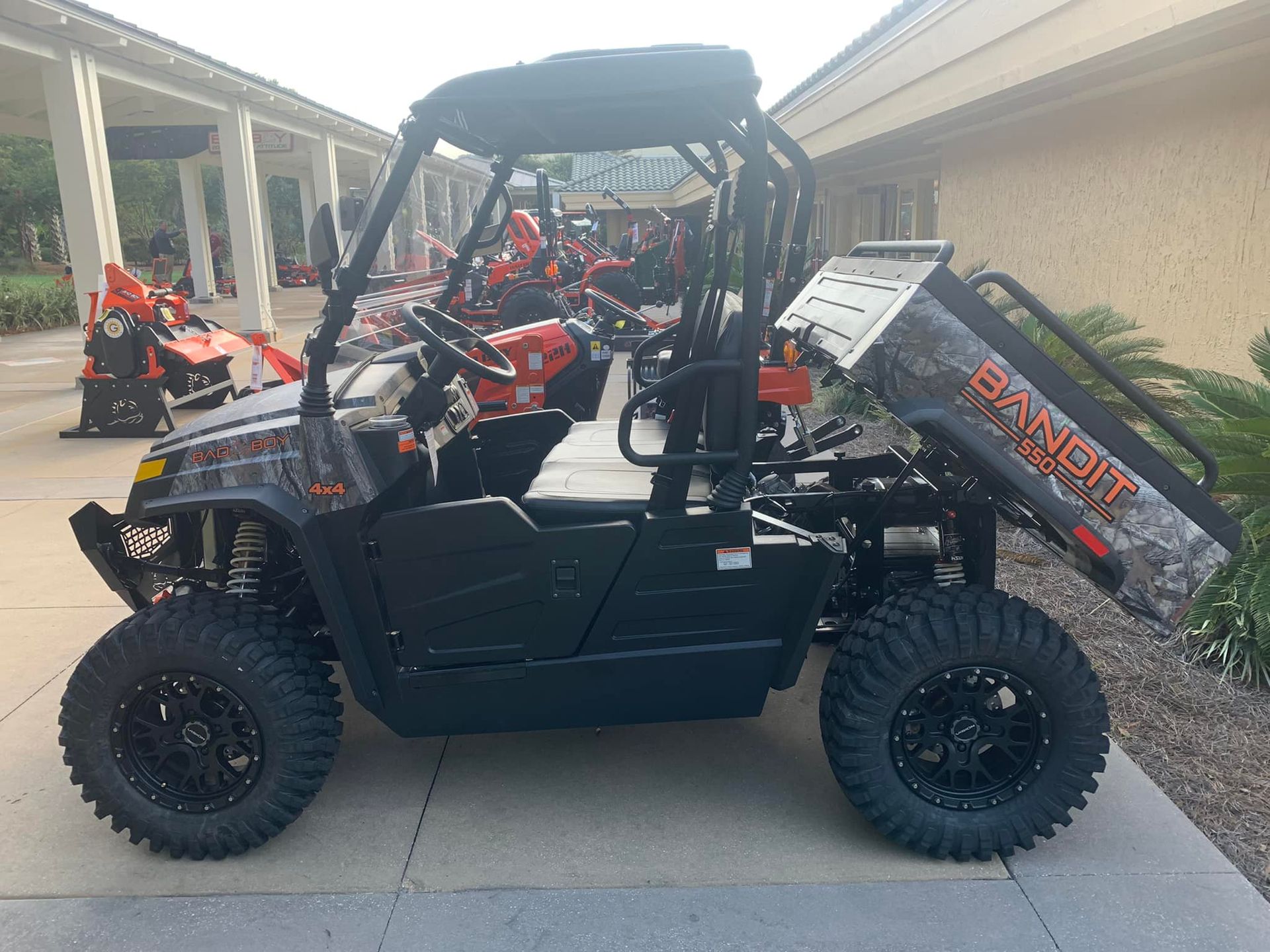 A ranger atv is parked in front of a building