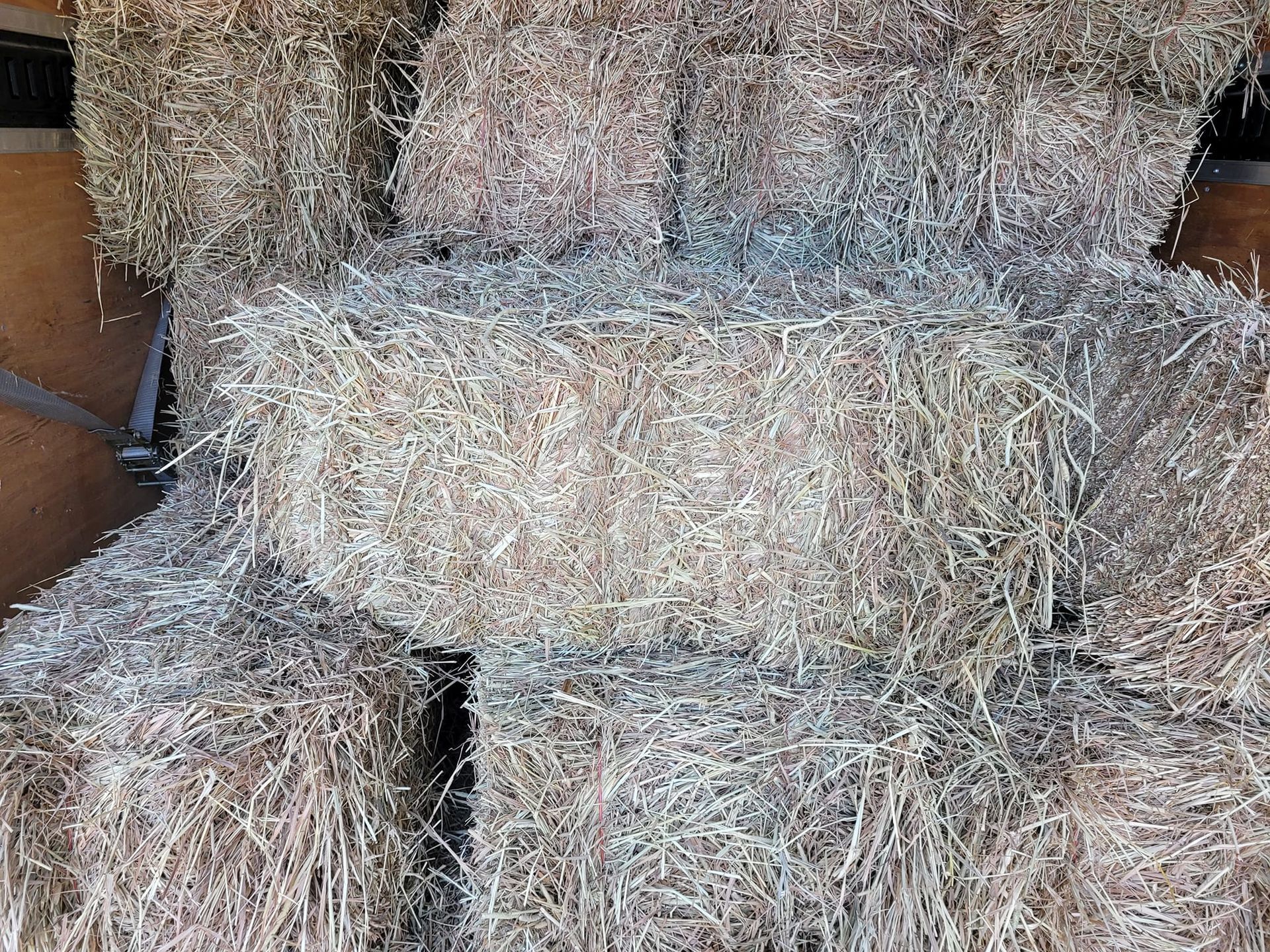 A bunch of hay bales stacked on top of each other.