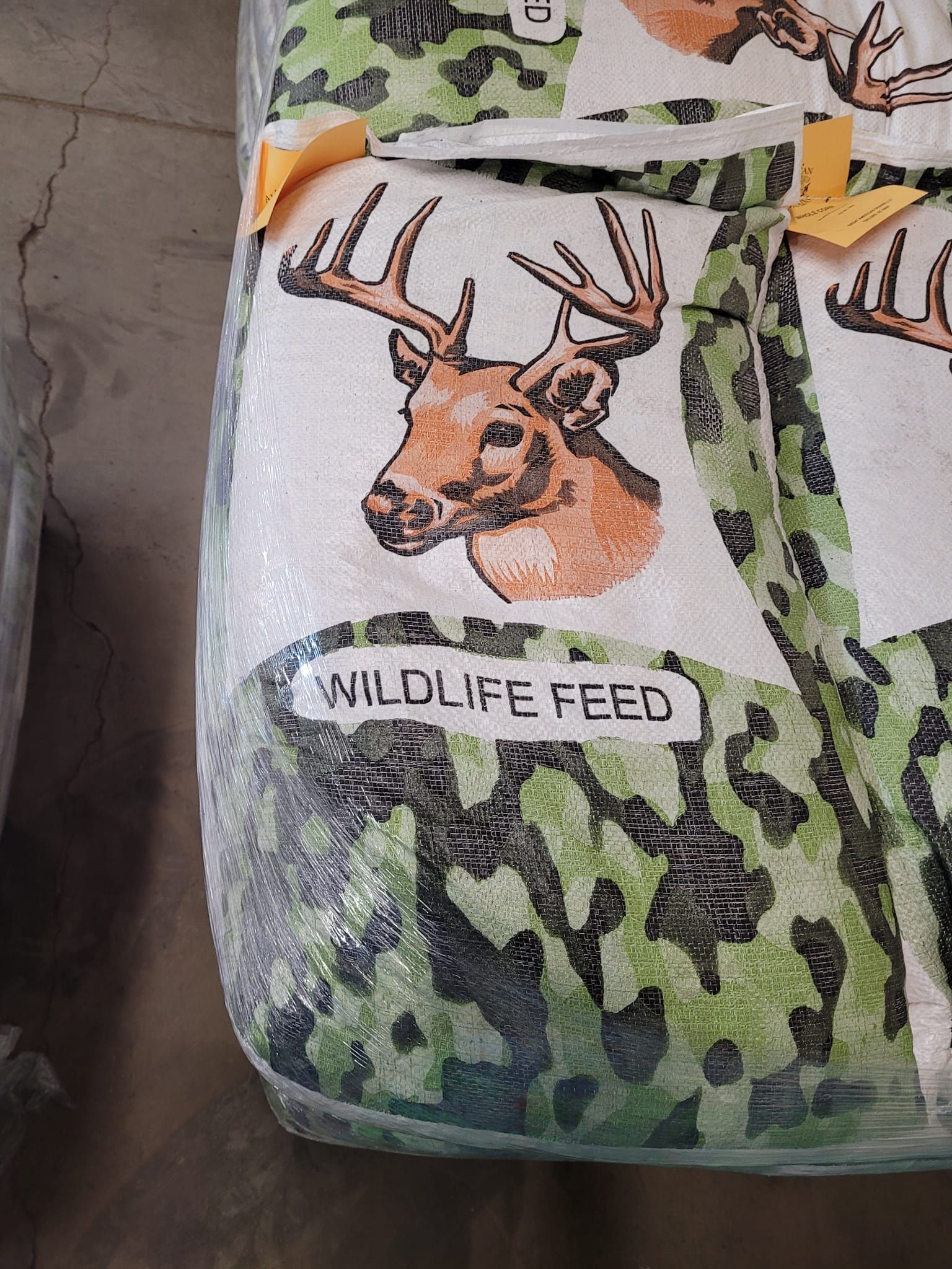 A bag of wildlife feed with a picture of a deer on it.