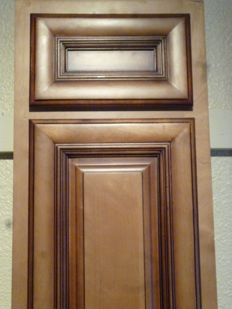 A close up of a wooden cabinet door