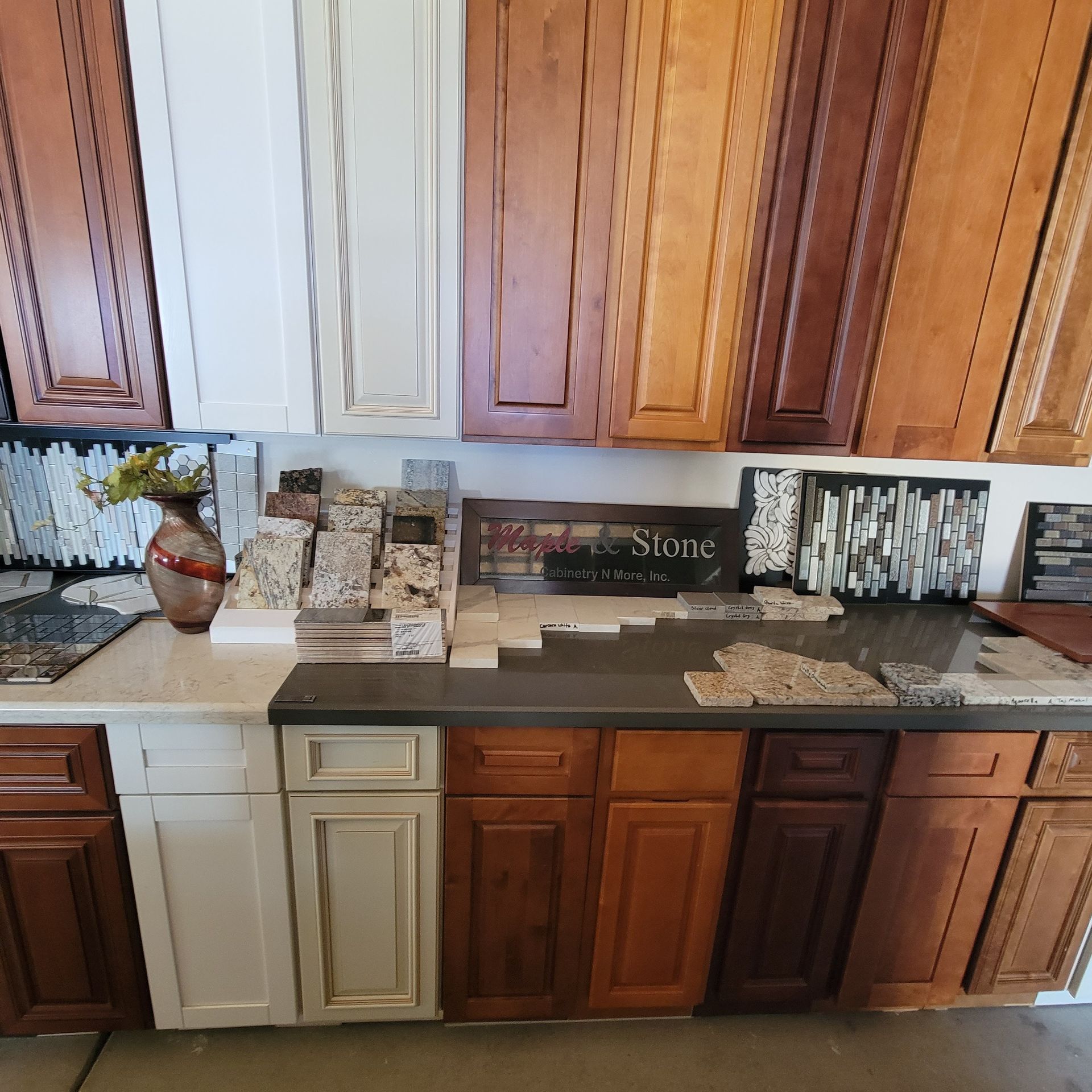 A kitchen with many different types of cabinets and counter tops
