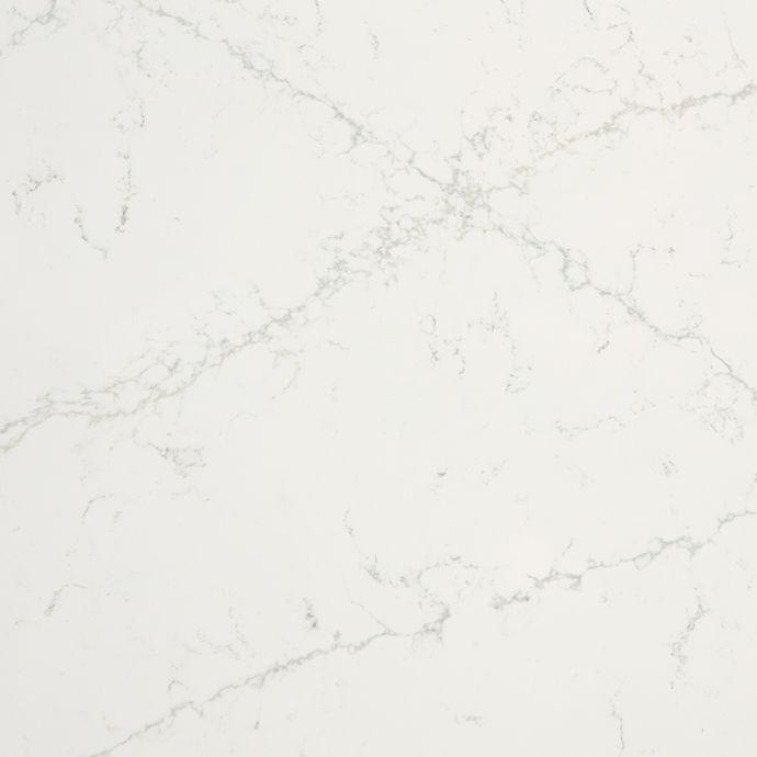 A close up of a white marble counter top.